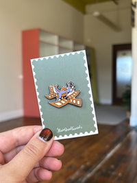 Figment Journey Into Imagination inspired enamel pin on Main Street Tourist backing card, Disney EPCOT pin for collectors and trading.