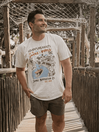 Man wearing a Rivers Of The World shirt,  a Disney Jungle Cruise inspired vintage t-shirt with riverboat and tropical design located in Magic Kingdom located at Disney World and Disneyland