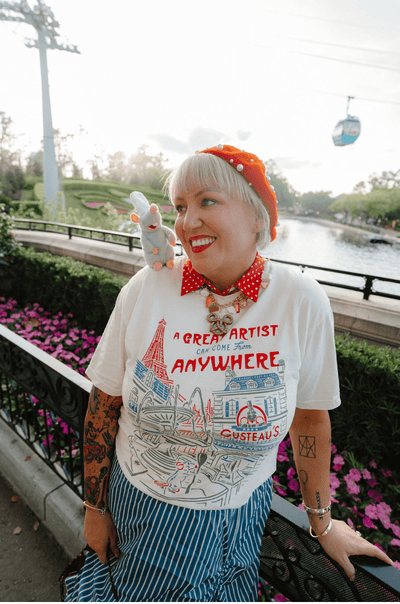 Girl with Remy Pal wearing the Little Chef Ratatouille Disney-Inspired tee at Epcot in Disney World 